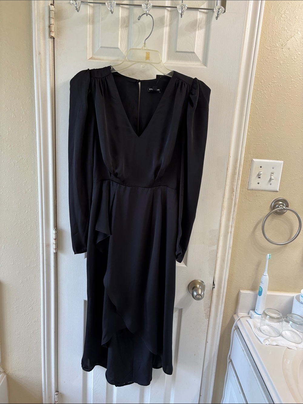 Express long sleeve fully lined wrap black dress. NWT